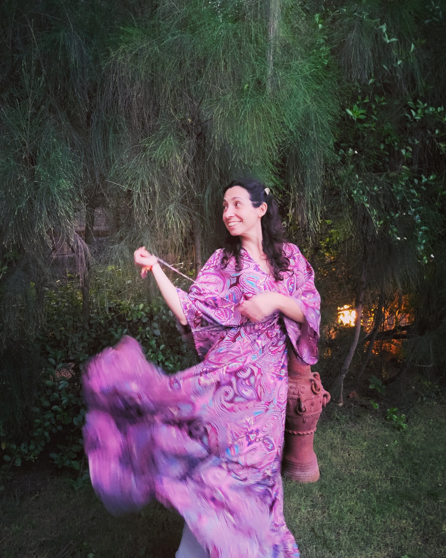 Woman in a rose dress in an outdoor setting